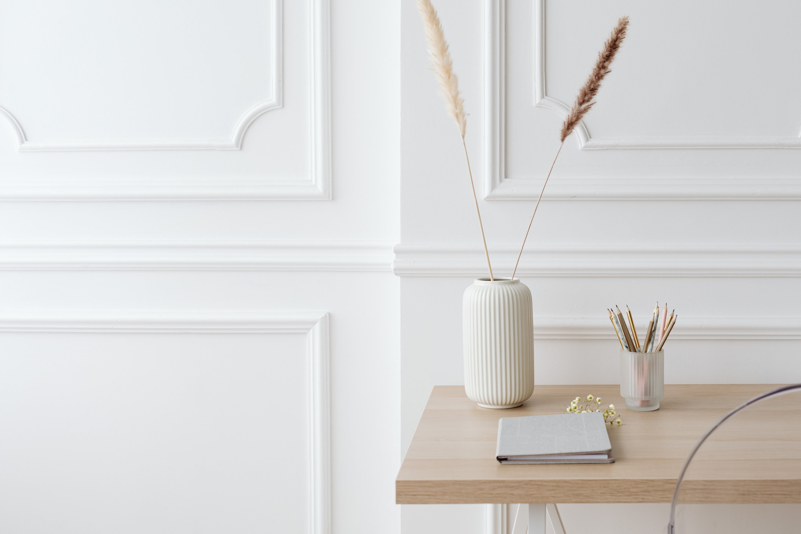 White Pillar Candle on Brown Wooden Table